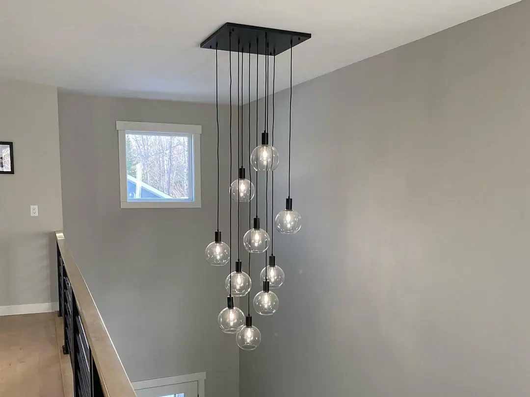 Metal Chandelier in stairwell from Hangout Lighting