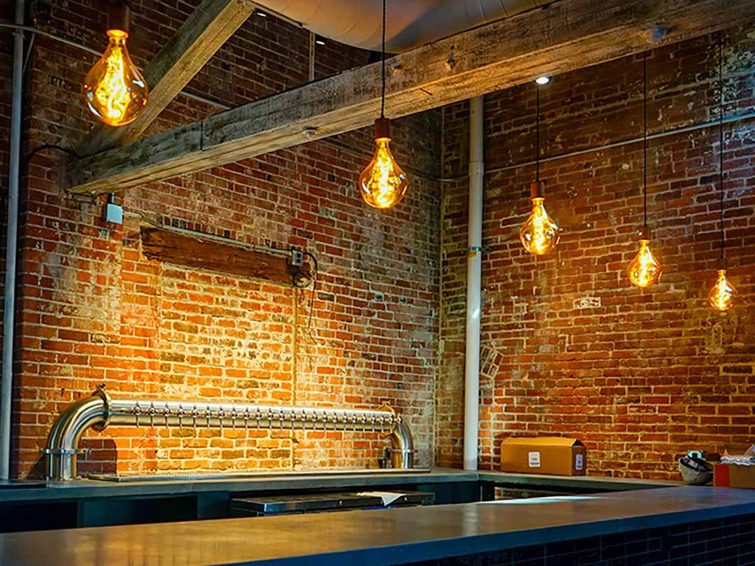 bar pendant lighting with oversized uneven pear bulbs hangout lighting