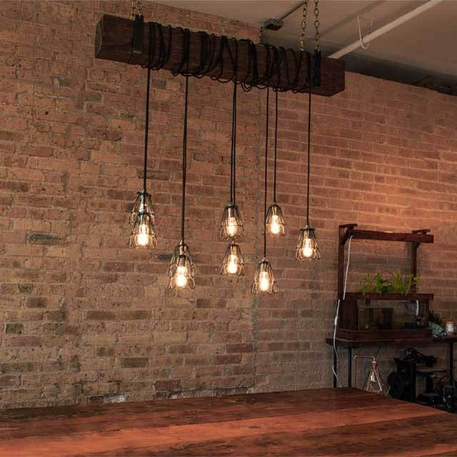 Faux Beam Pendant Light Wrap Black and Brass over Dining Table