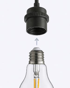 Light bulb with a black base being inserted into a silver base. E26 socket