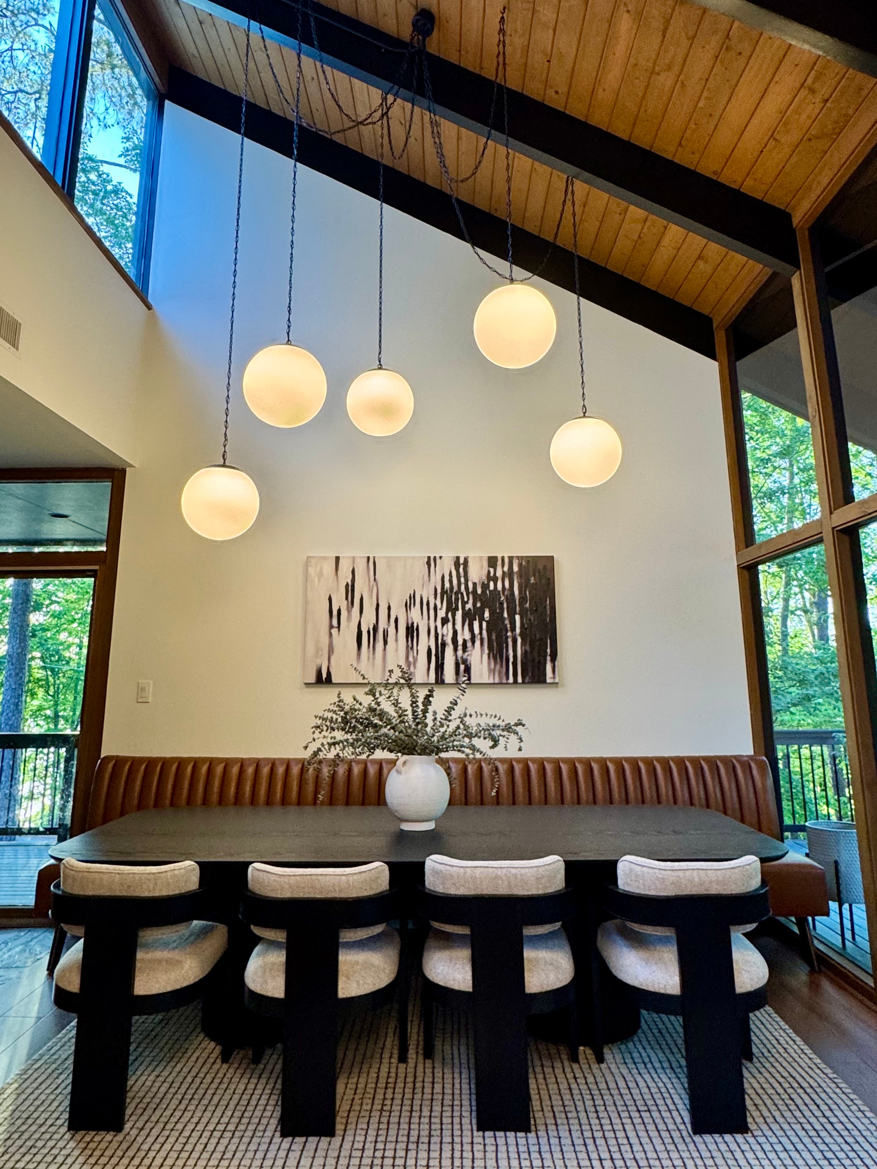 high ceiling sloped dining room chandelier for tall ceilings with 5 globe pendants.