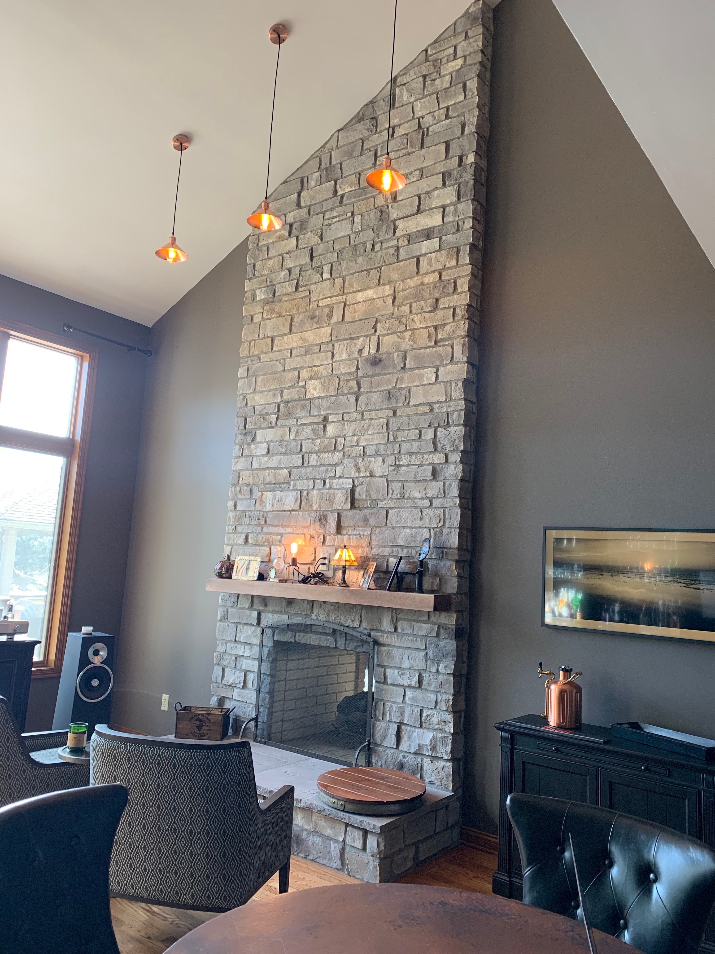 custom pendant light with a copper cone shade
