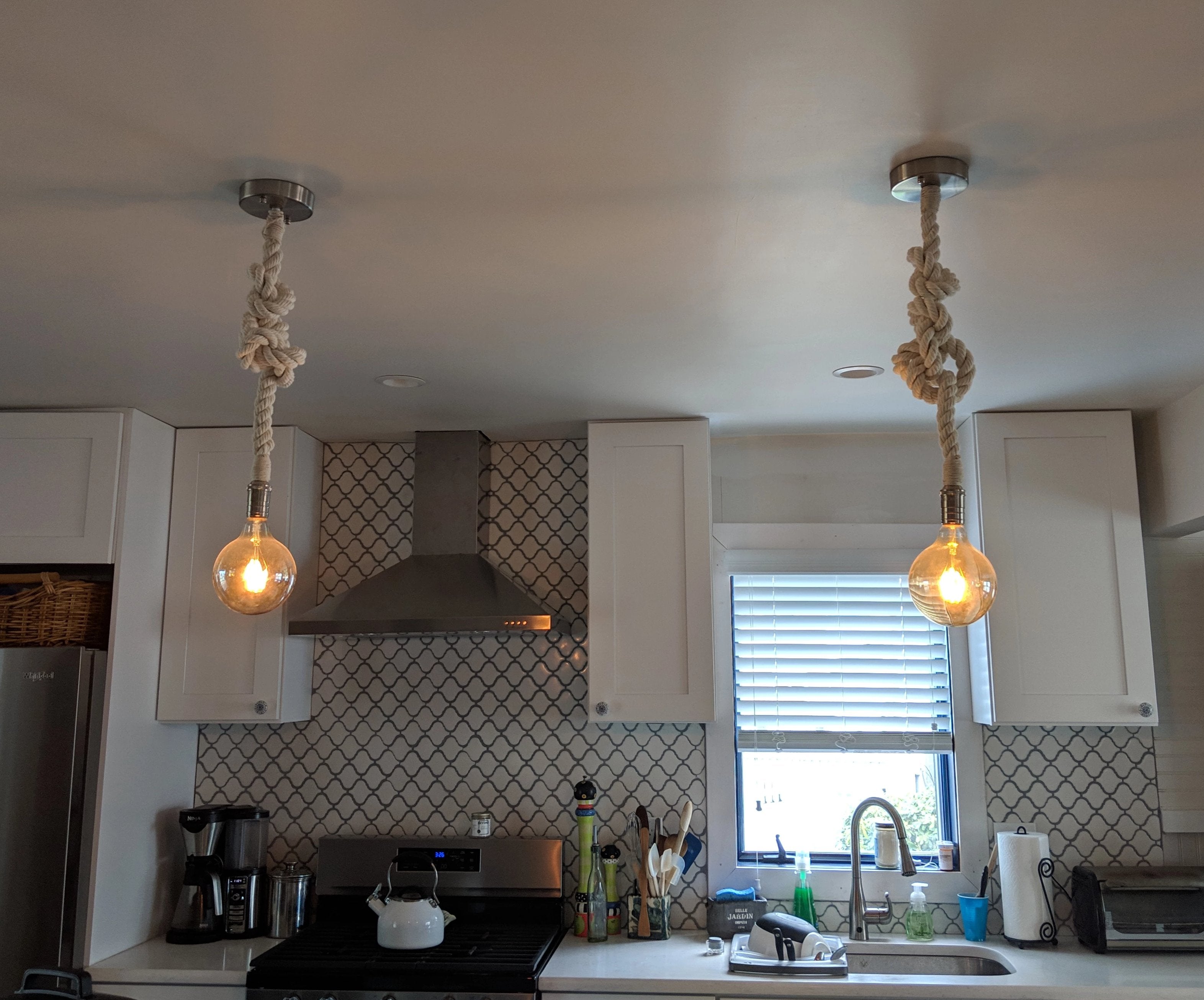 rustic rope pendant lights in a kitchen with nickel