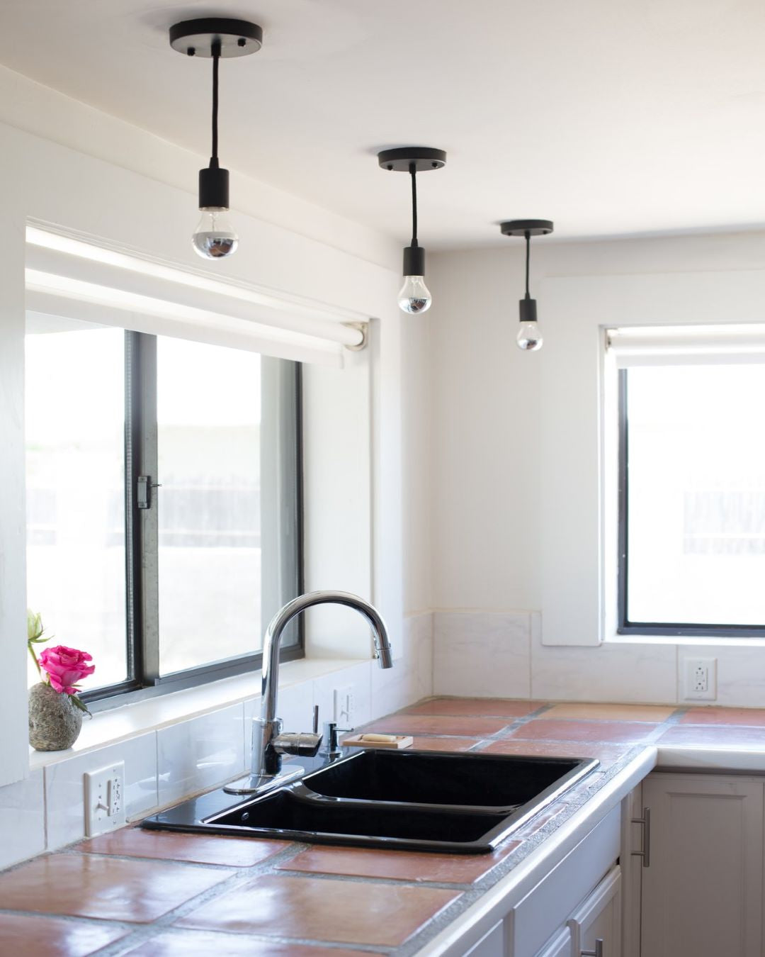 Simple Black Pendant Lights over Kitchen Sink