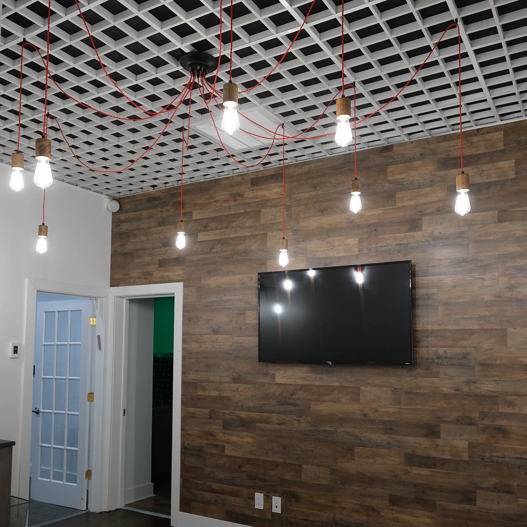 red swag chandelier on grid ceiling