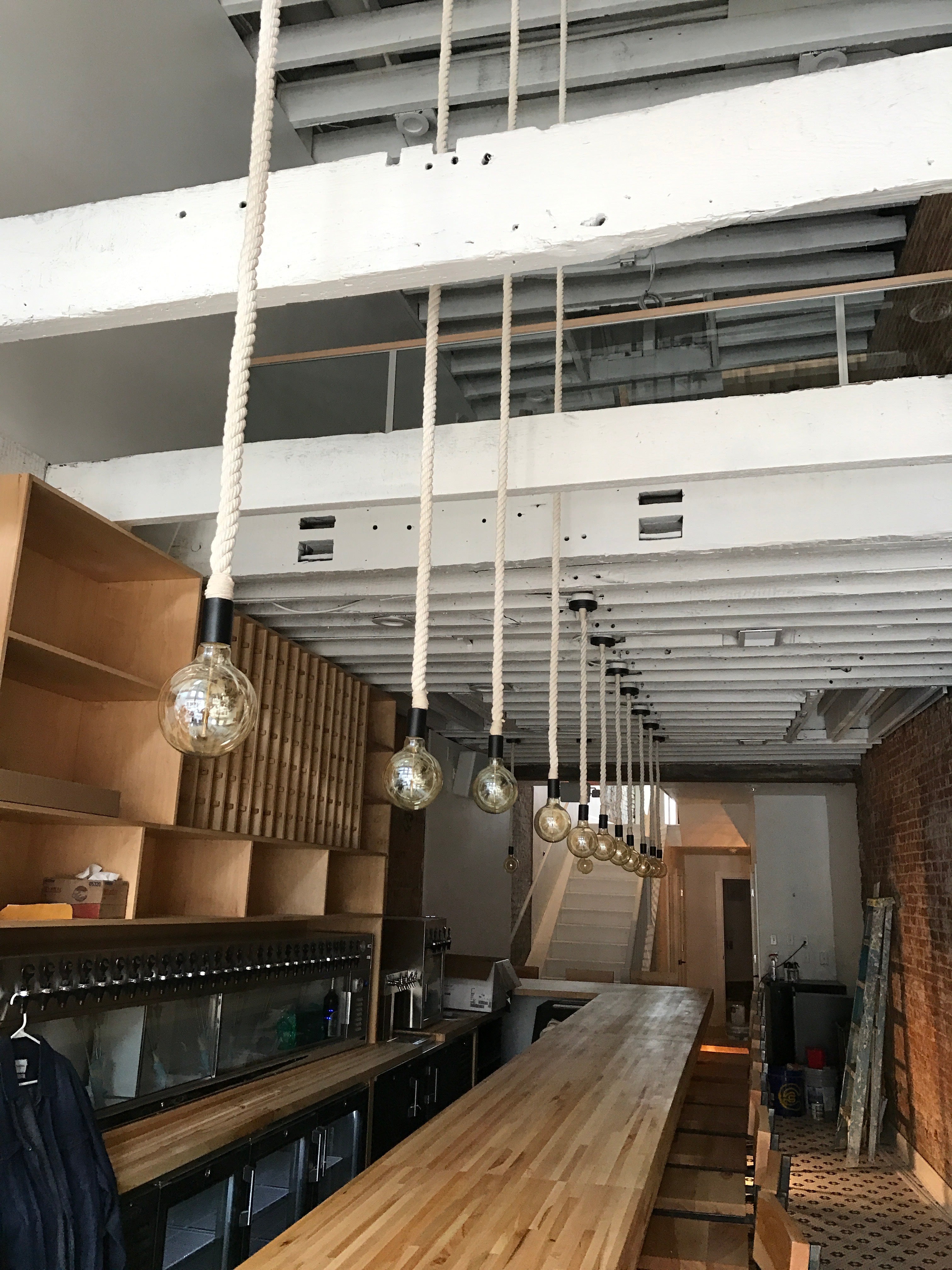 Rustic Rope pendant lights over a bar