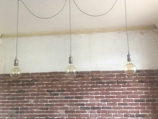 3 pendant swag chandelier in brick room