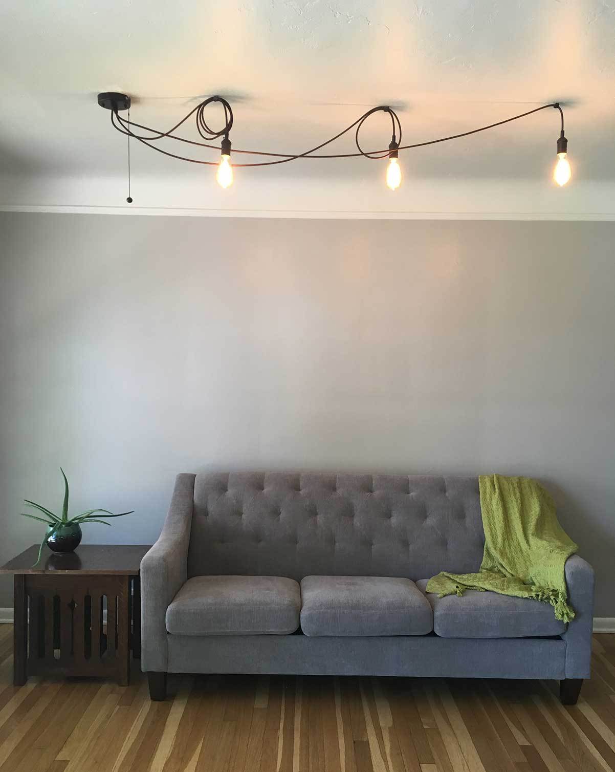 cute 3 pendant swag chandelier over couch