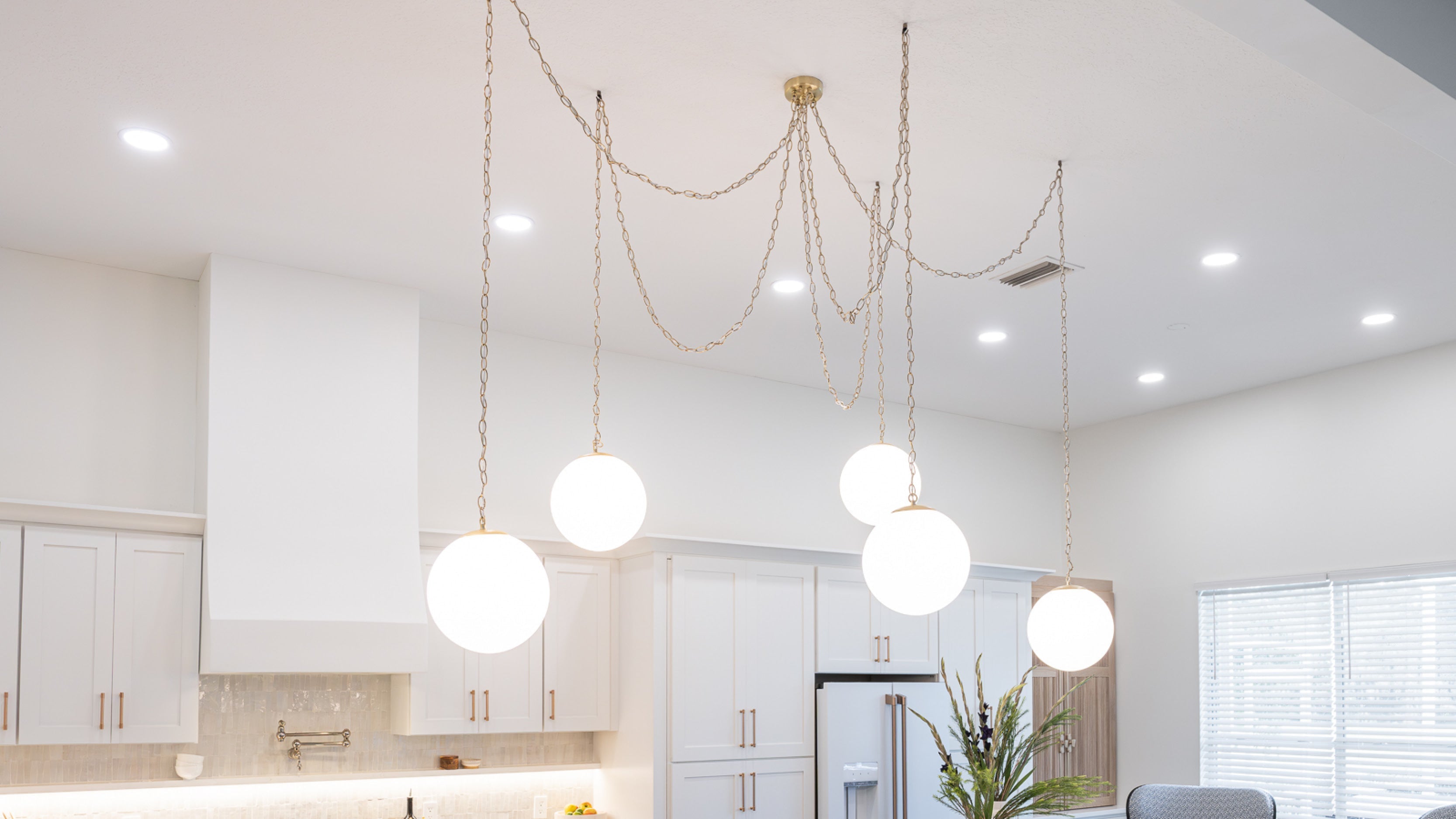 Swag Chandelier with brass chain at Hangout Lighting