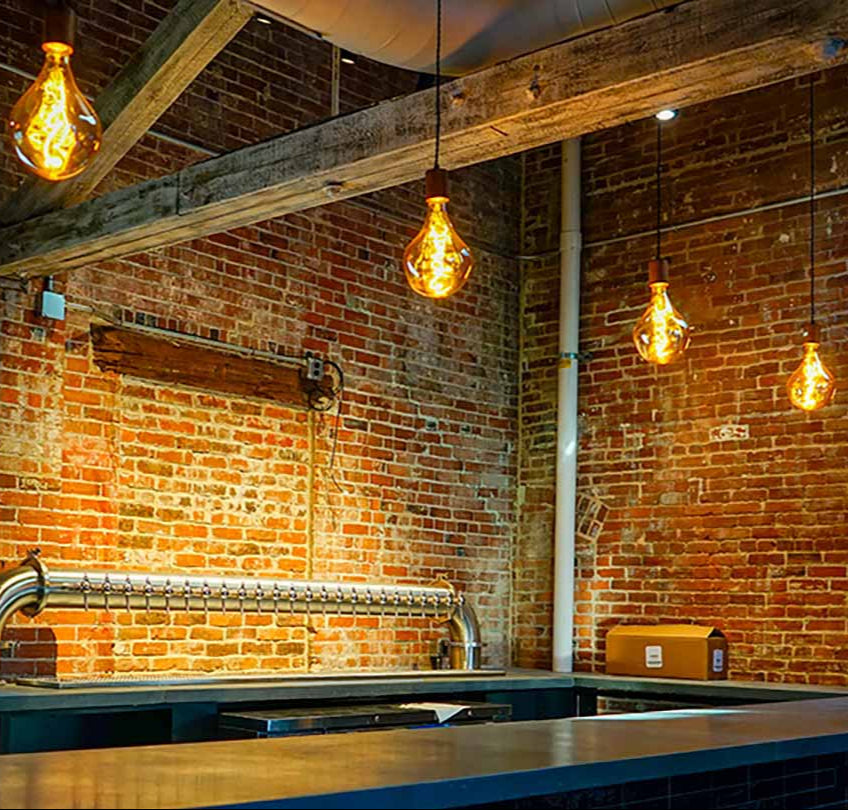 bar pendant lighting with oversized uneven pear bulbs hangout lighting