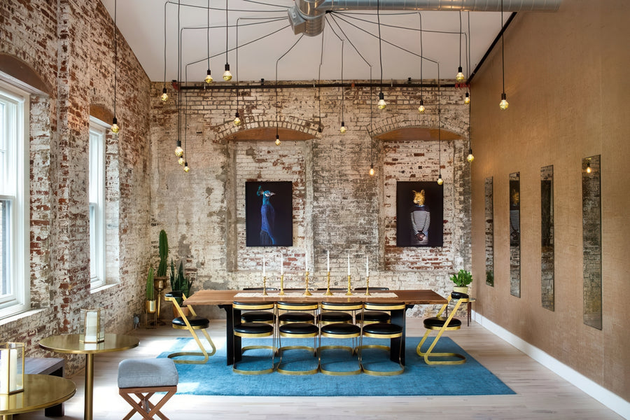 Modern dining room with exposed brick wall and contemporary decor large chandelier