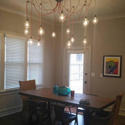 14 Red Pendants Swag Chandelier over a Dining Table  light fixture
