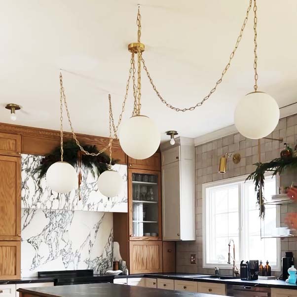 brass chain pendant light chandelier over kitchen island elegant modern