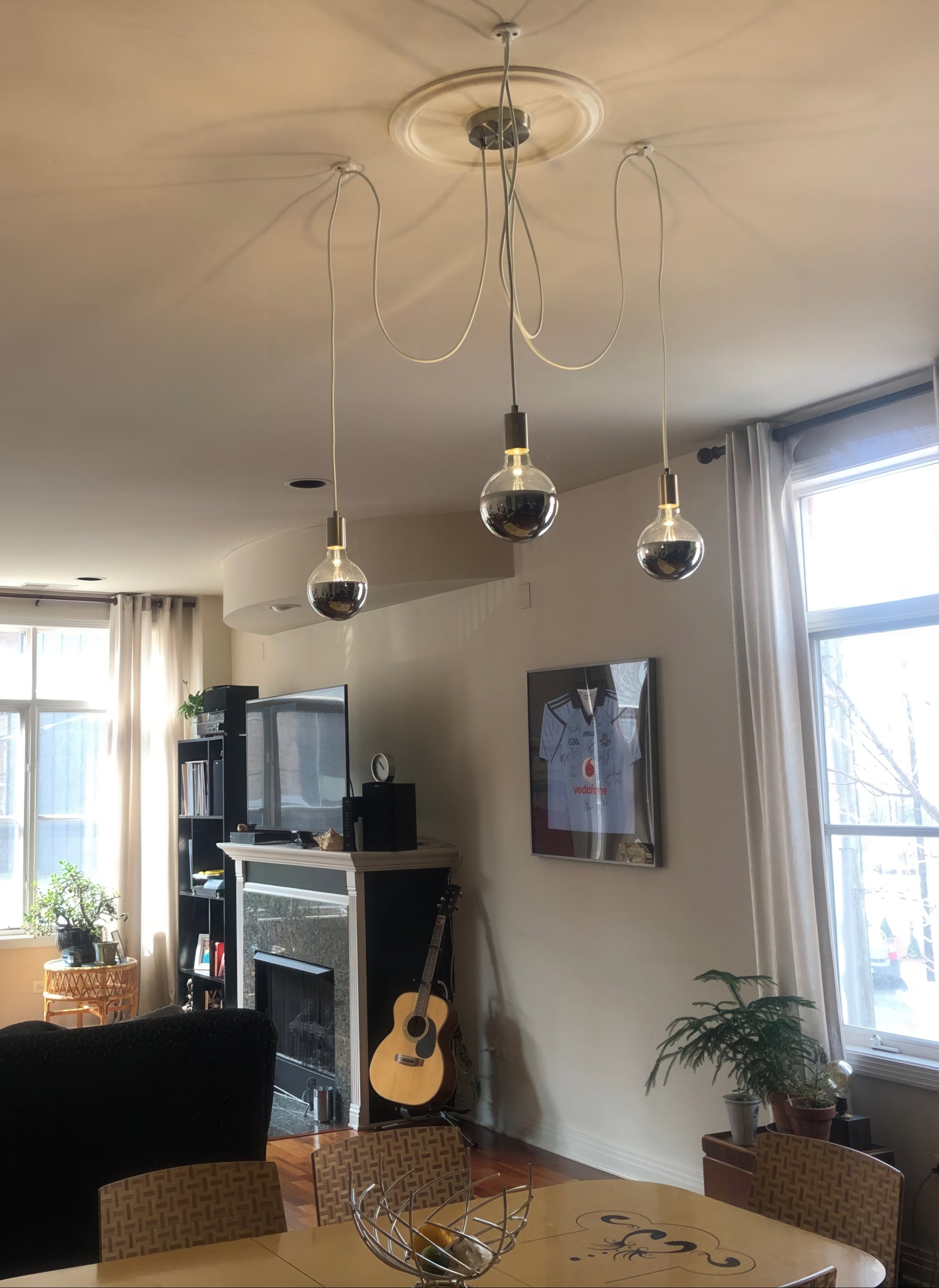 chrome dipped bulbs 3 pendant swag chandelier over vintage dining table
