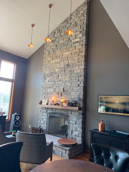 custom pendant light with a copper cone shade