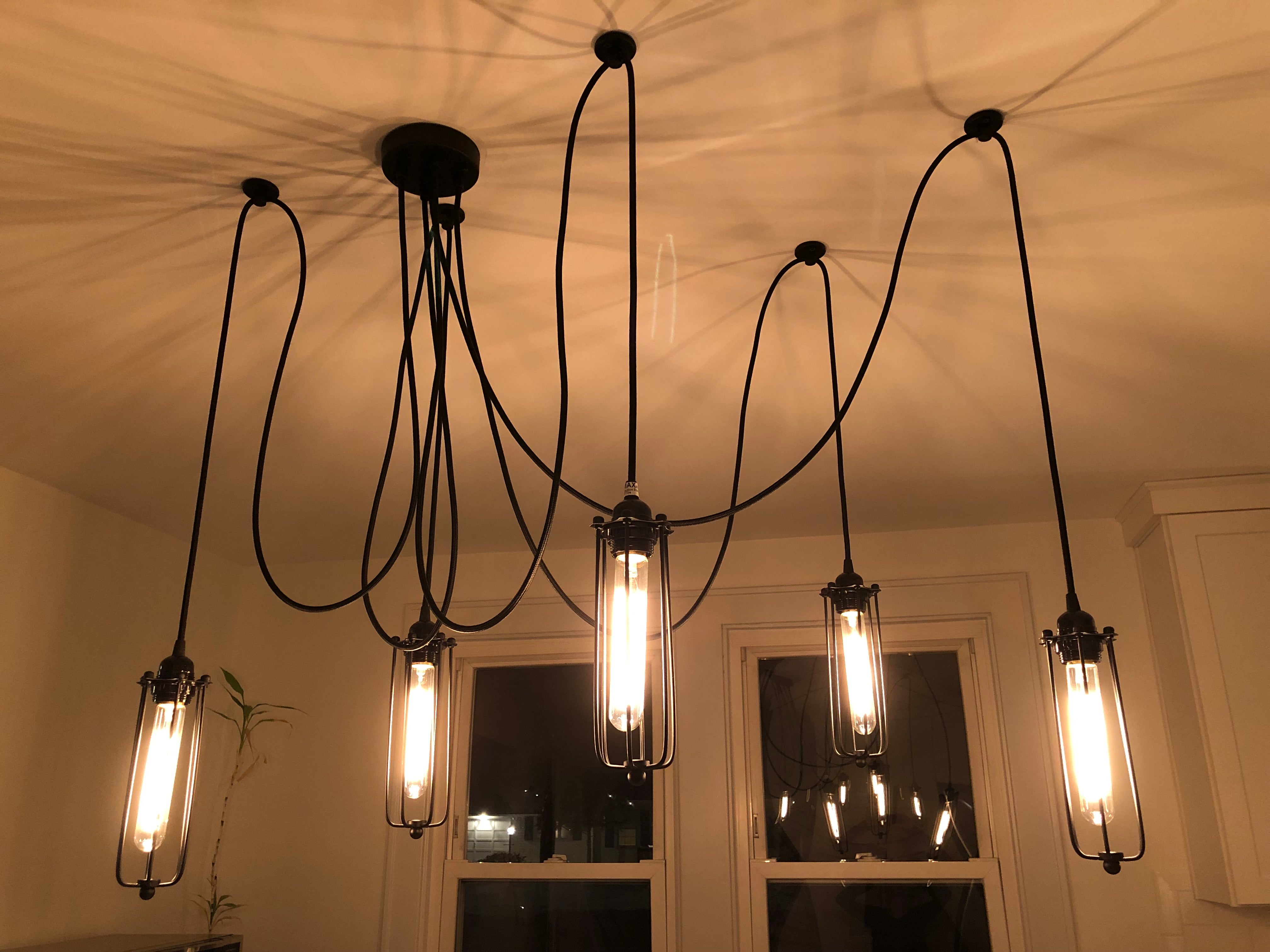 black industrial tube cage swag chandelier